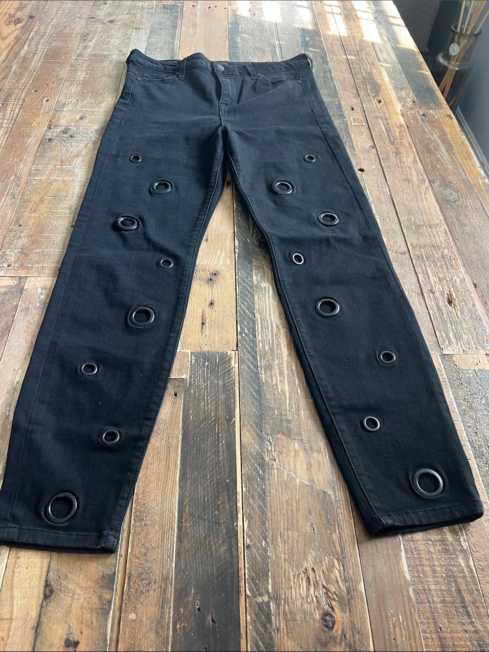 Celebrity Pink Black Skinny Jeans with Grommet Accents